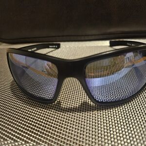 Revo Crystal Blue Polarized sport sunglasses with black frames,